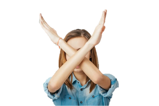 A woman with her arms crossed in a 'no' gesture